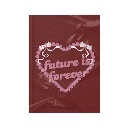 Future Is Forever Nurture the Vision journal in deep red with a pink heart graphic and Y2K inspired bow details.