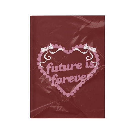 Future Is Forever Nurture the Vision journal in deep red with a pink heart graphic and Y2K inspired bow details.