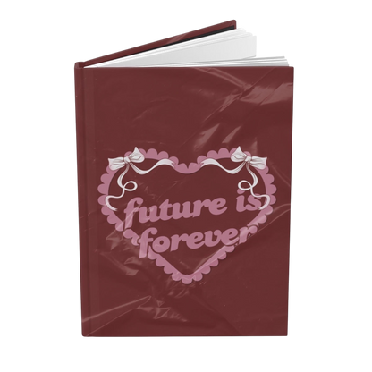 Future Is Forever Nurture the Vision journal in deep red with a Y2K-inspired pink heart and bow graphic cover.