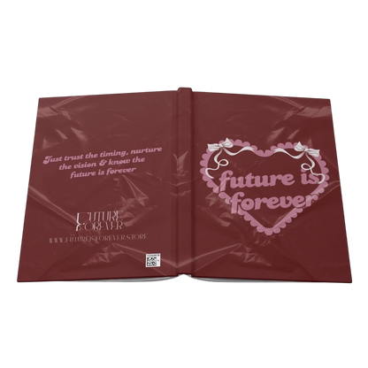 Future Is Forever Nurture the Vision journal with a deep red cover, heart graphic, and Y2K inspired typography.